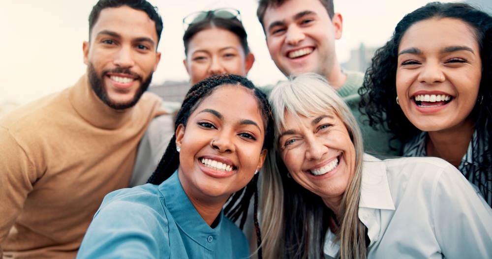 Group of smiling friends taking a selfie